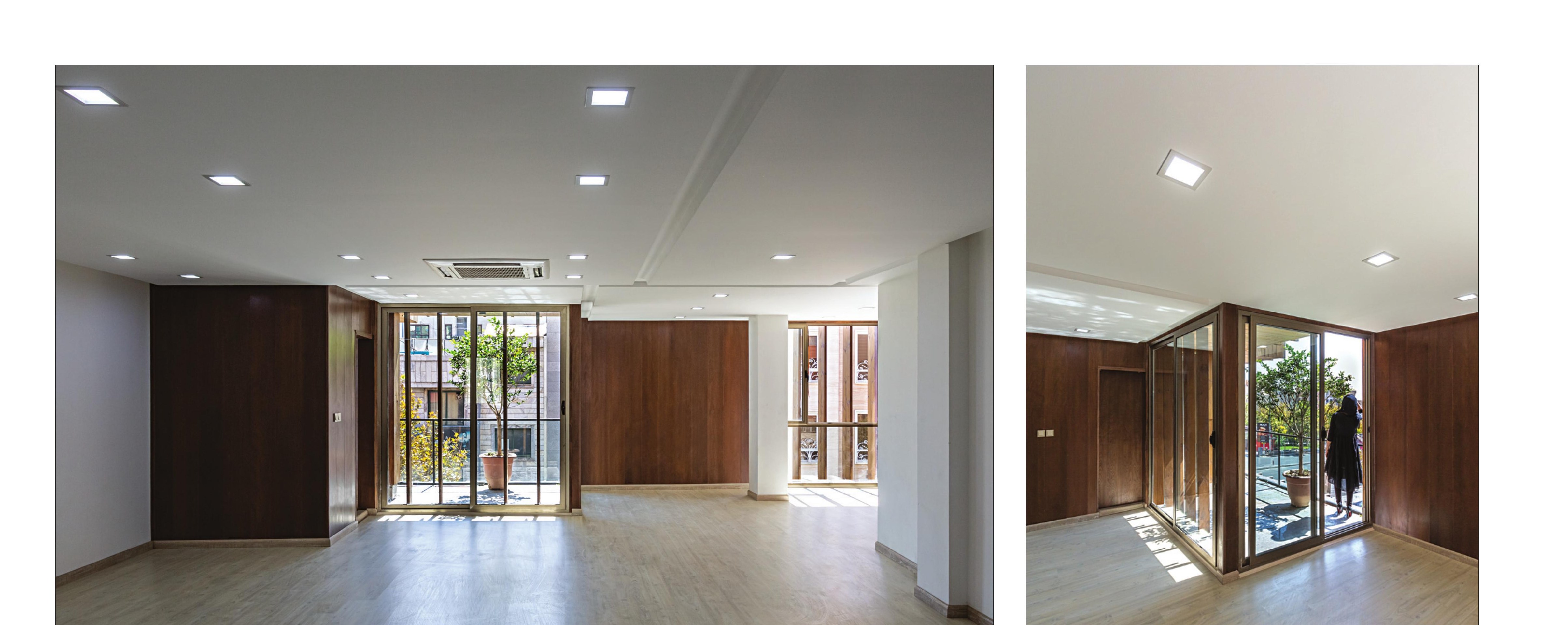 Interior office floors with timber-paneled walls and floor-to-ceiling glass.