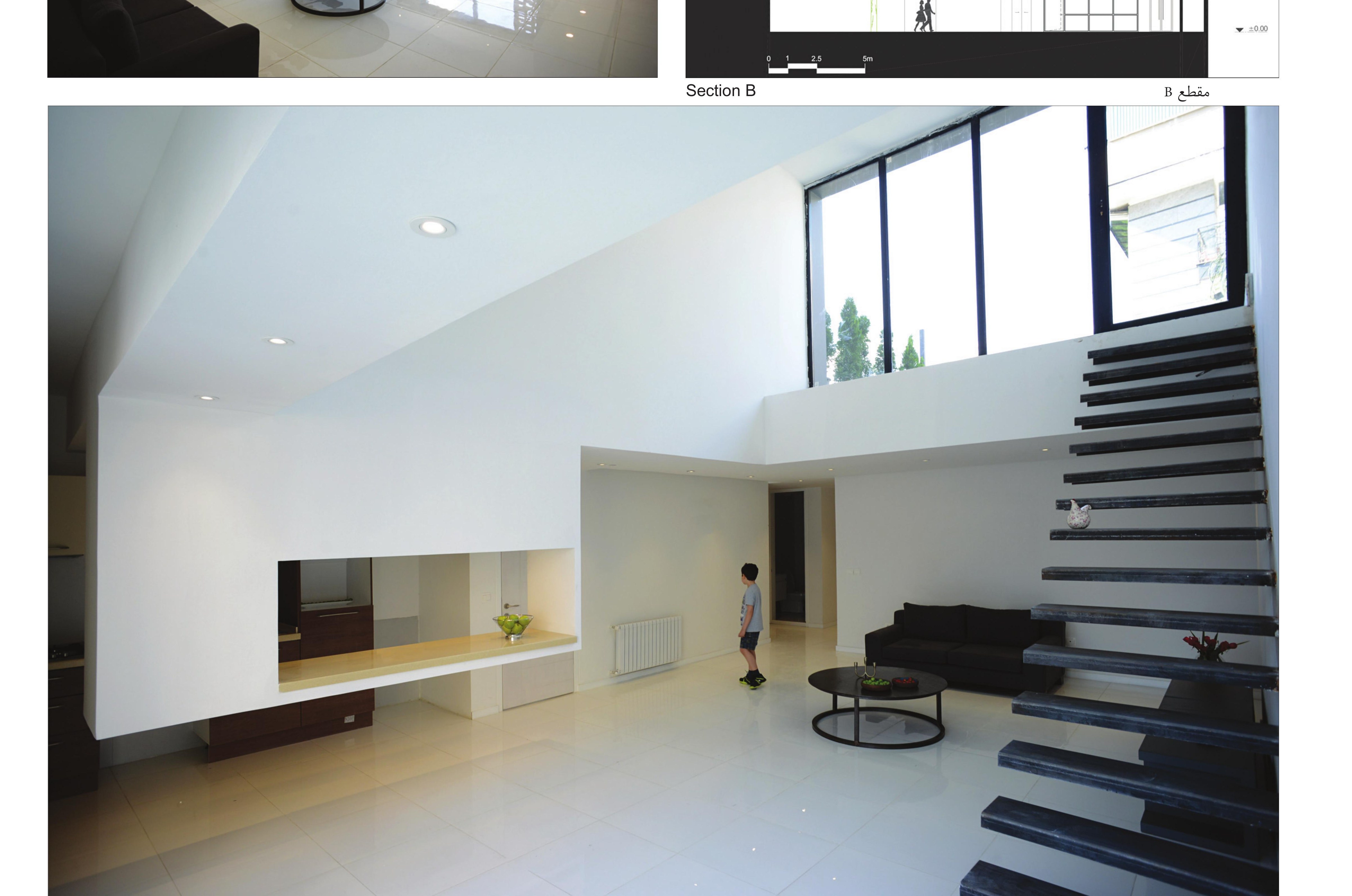 Double-height living room — the floating stair and the broad clerestory above.