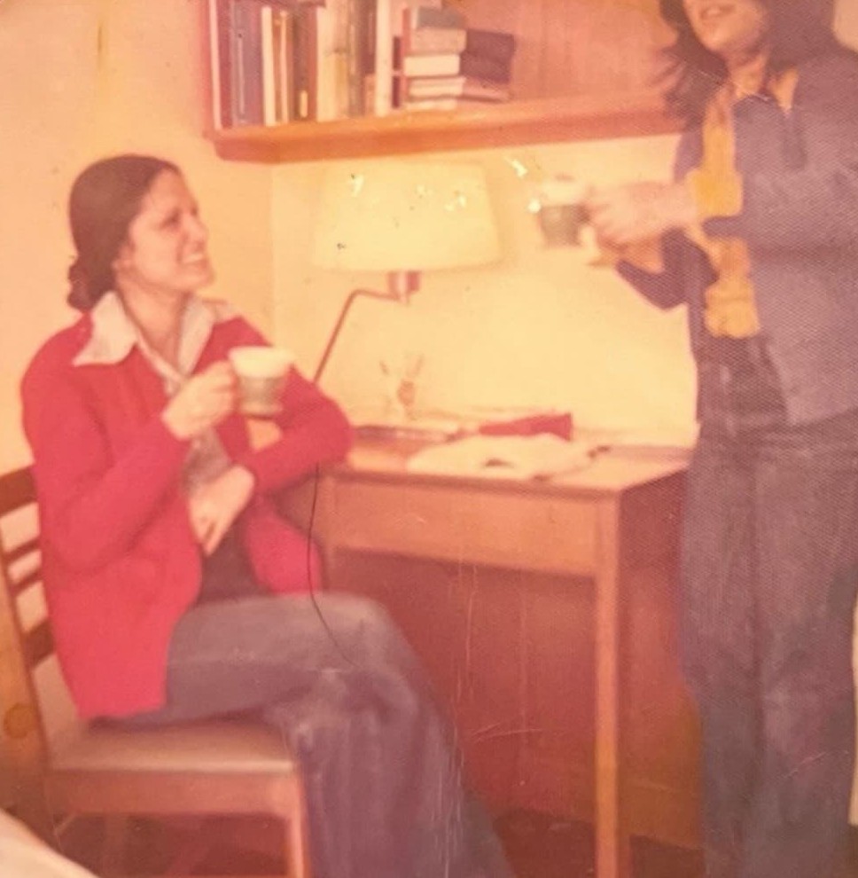 Young Soheila Beski at her desk