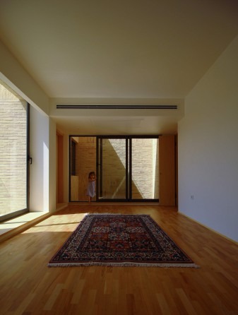 Material palette of brick, plaster, and wood
