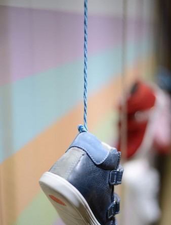 Triangular frame and hanging-shoe display