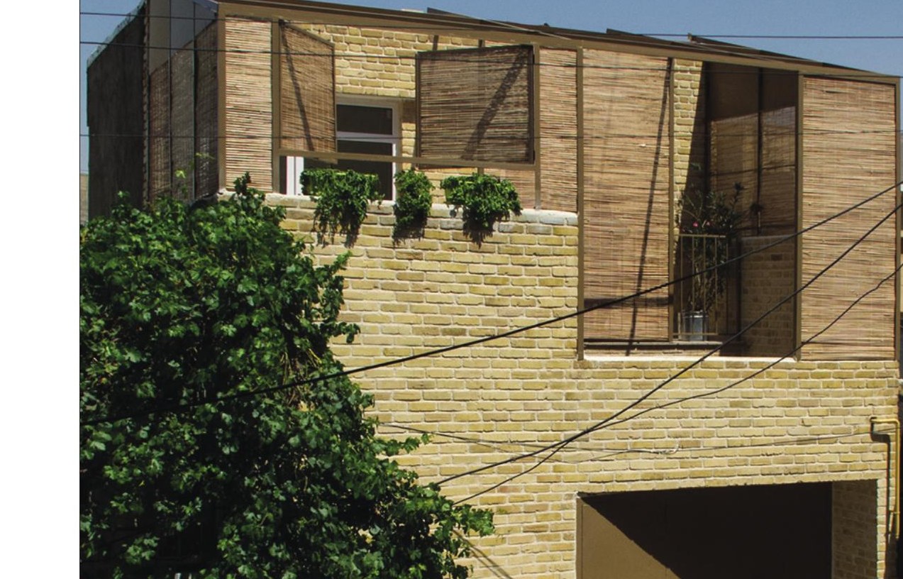 Alley view of the brick + bamboo upper floor