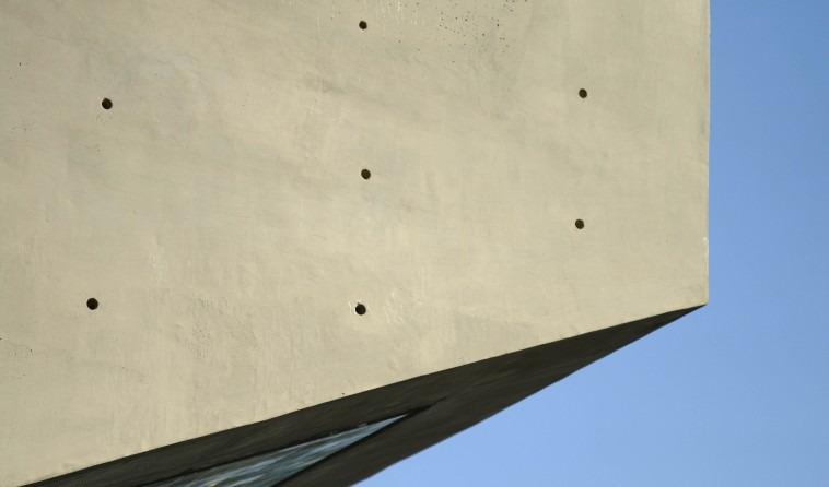 Concrete Restaurant — entry frame with hand-made coloured tiles