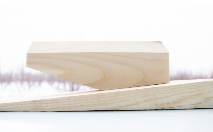 Concept model in wood showing the diagonal cut along the length of the building