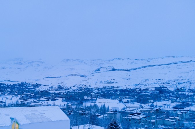 Snow panorama across the Damavand plain with the villa just visible at the corner