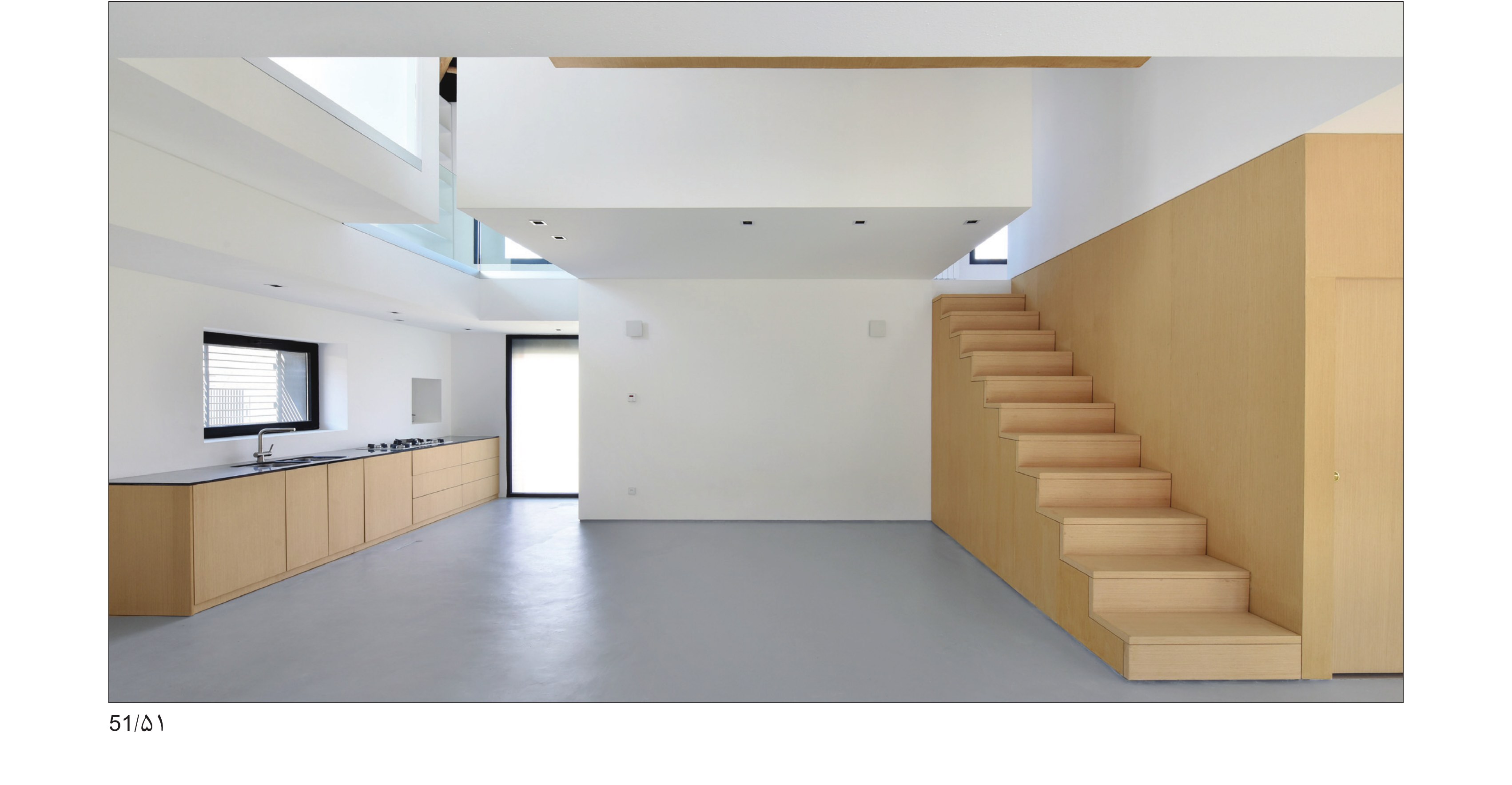 Kitchen and living hall along the cleared brick shell
