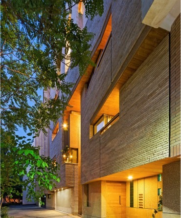 Malek Residential Building — an interior central living area with a stair and dark wood floors