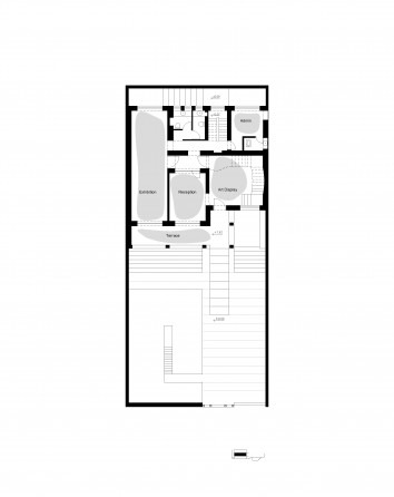 The Nabshi Gallery basement / shelter memorial — a sunken room with concrete walls and an installation under a roof of trusses