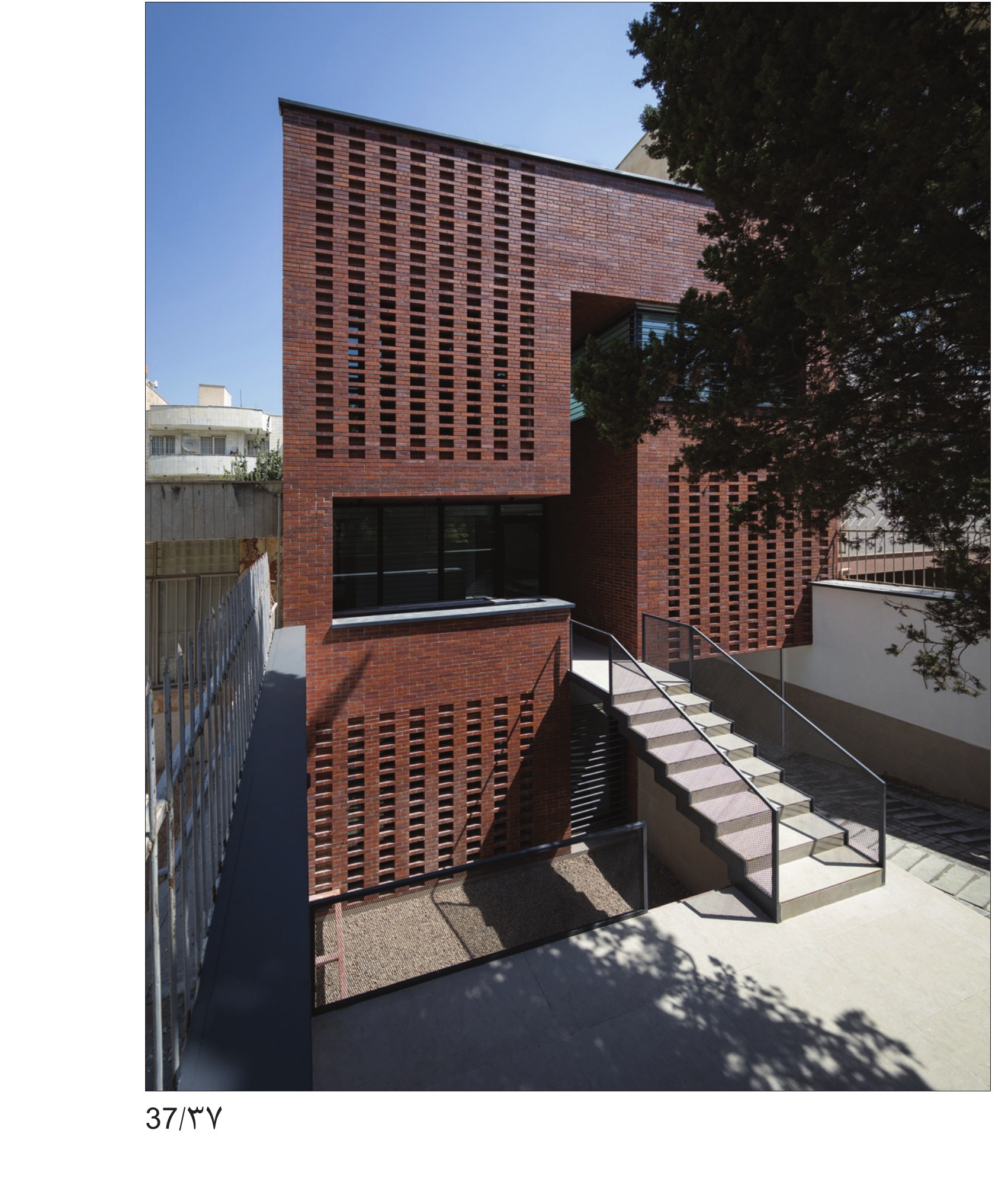 Brick facade and stepped entry from the alley