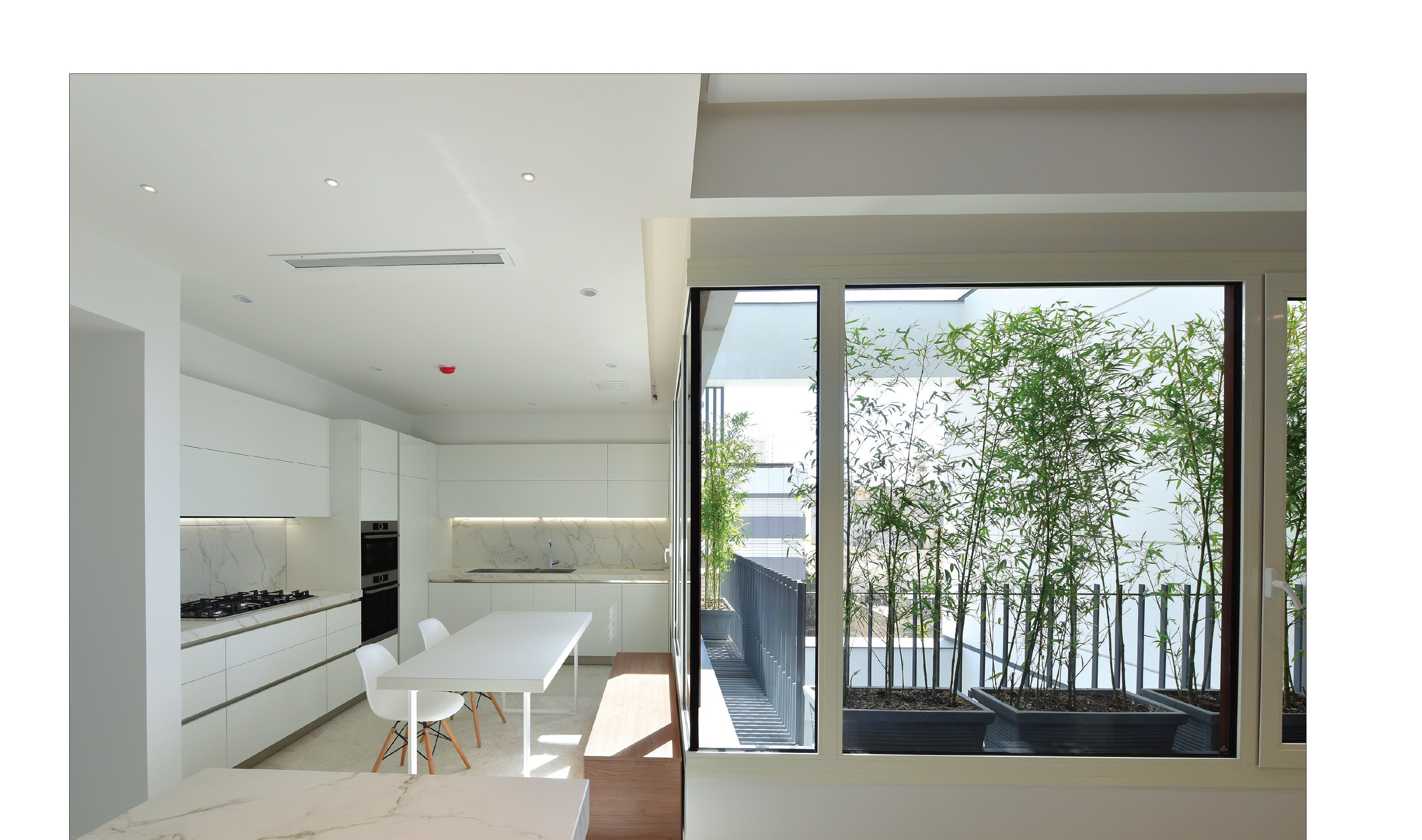 Kitchen and private living room with the patio window