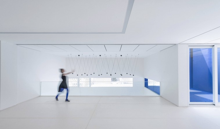 White interior open to the sky through the central void