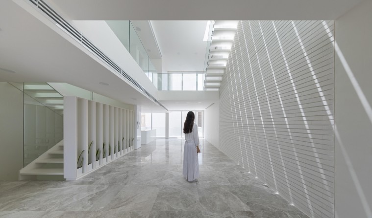 Interior with mezzanine and louvered screen wall