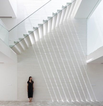 Roof-stair skylight against the louvered wall