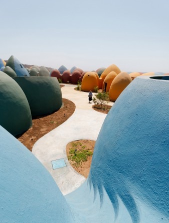 Domes among the trees and the desert paths