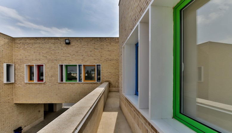 Continuous brick-and-stone facade