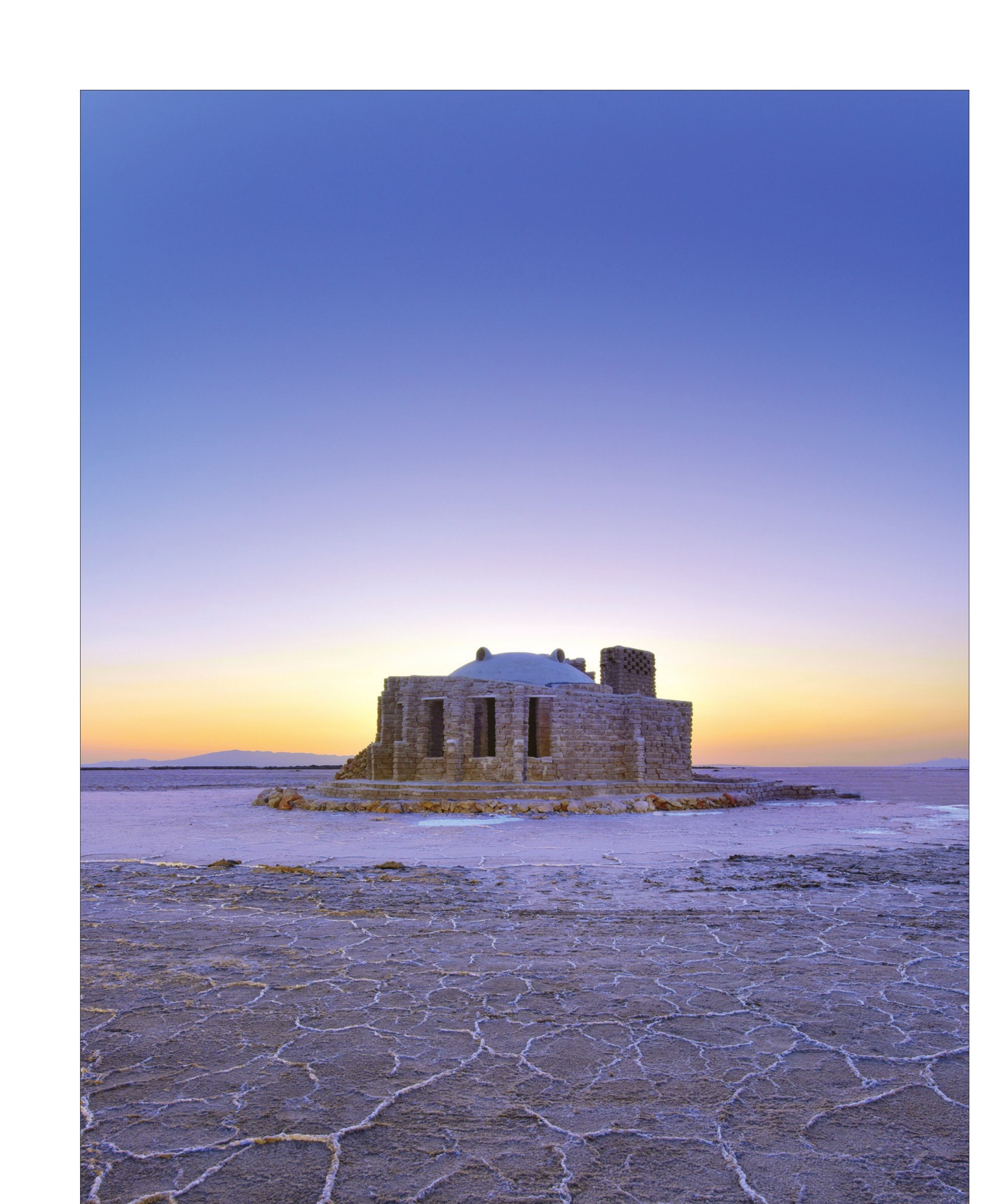 Wide salt-lake panorama at dusk with the dome