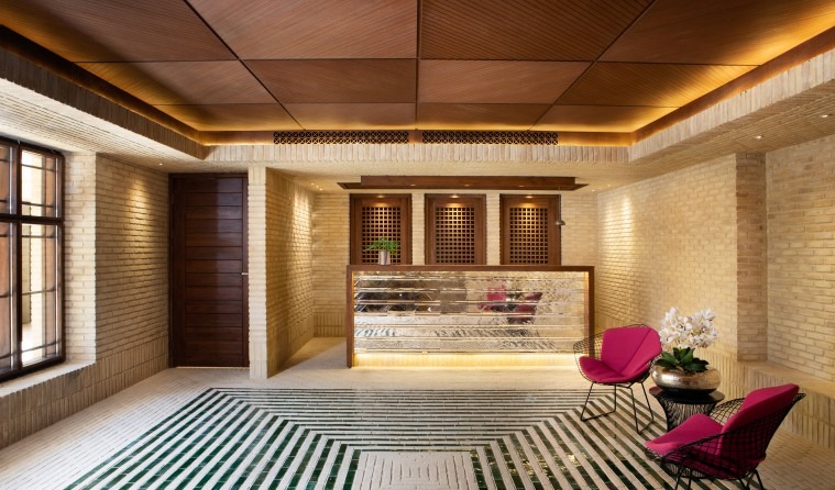 Brick-vaulted lobby with reception