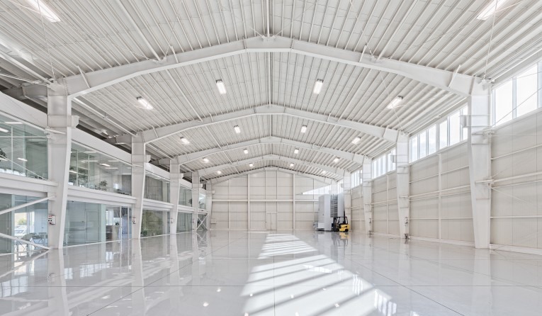 Warehouse interior — box-in-box service volume inside the larger hall