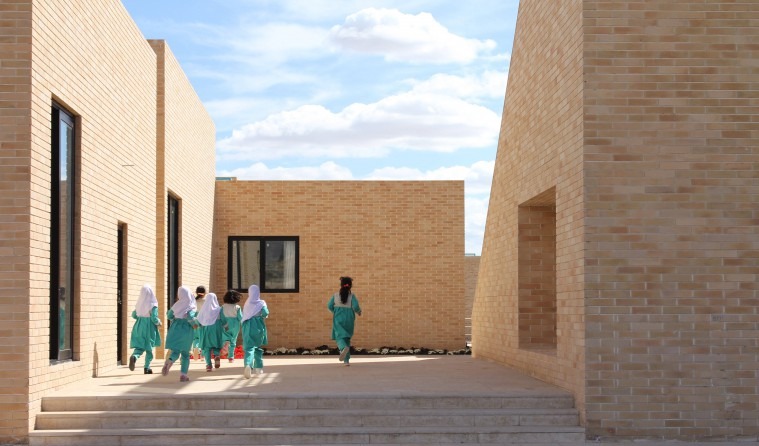 Children gathering on the courtyard steps